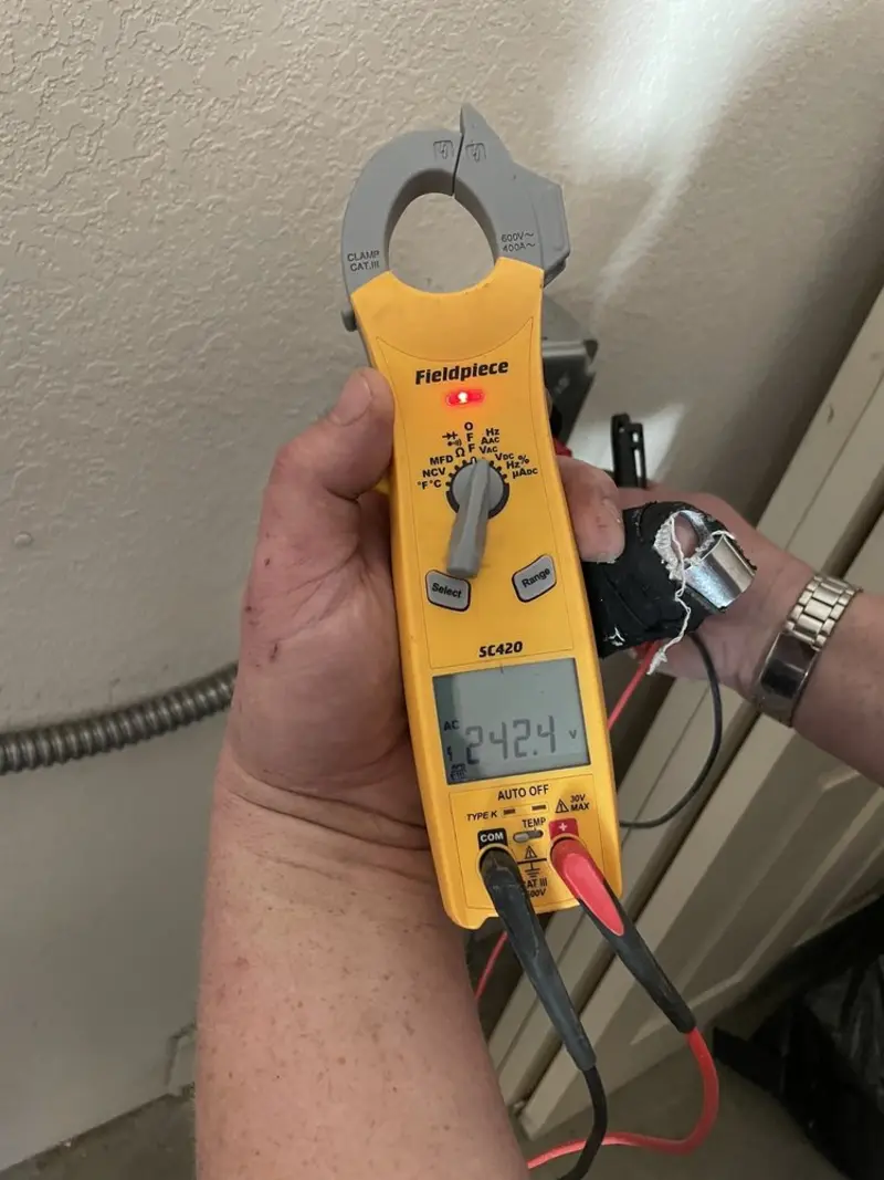 Voltage testing with clamp meter during Electrical Installation Services in Long Lake
